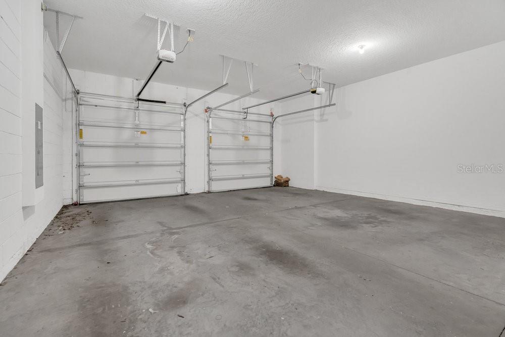 12880 Westside Vlg Loop Windermere, FL 34786 - Photo 32 of 42 a view of a room with garage