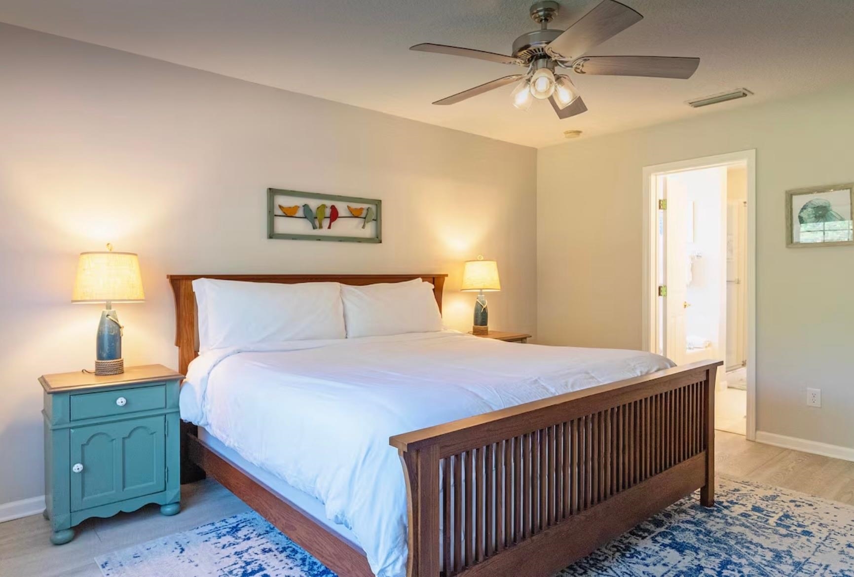 5340 4th Street St. Augustine, FL 32080 - Photo 12 of 29 a bedroom with a bed and a chandelier