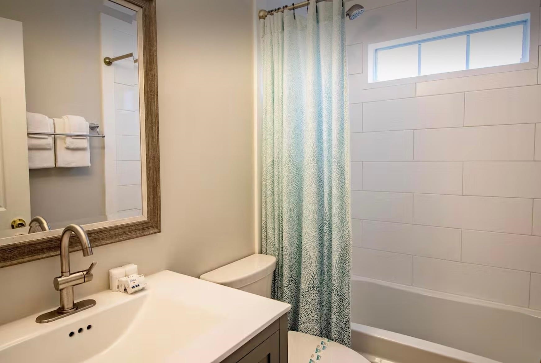 5340 4th Street St. Augustine, FL 32080 - Photo 18 of 29 a bathroom with a sink a toilet and shower