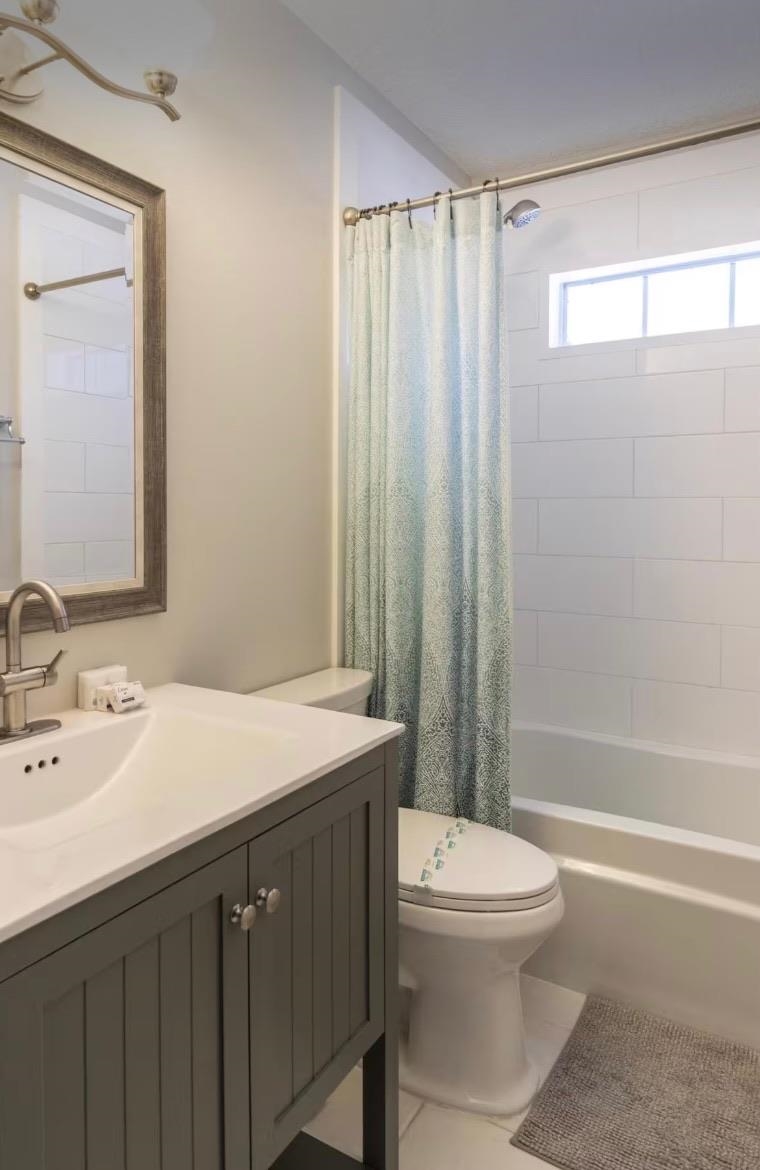 5340 4th Street St. Augustine, FL 32080 - Photo 19 of 29 a bathroom with a sink a toilet and shower