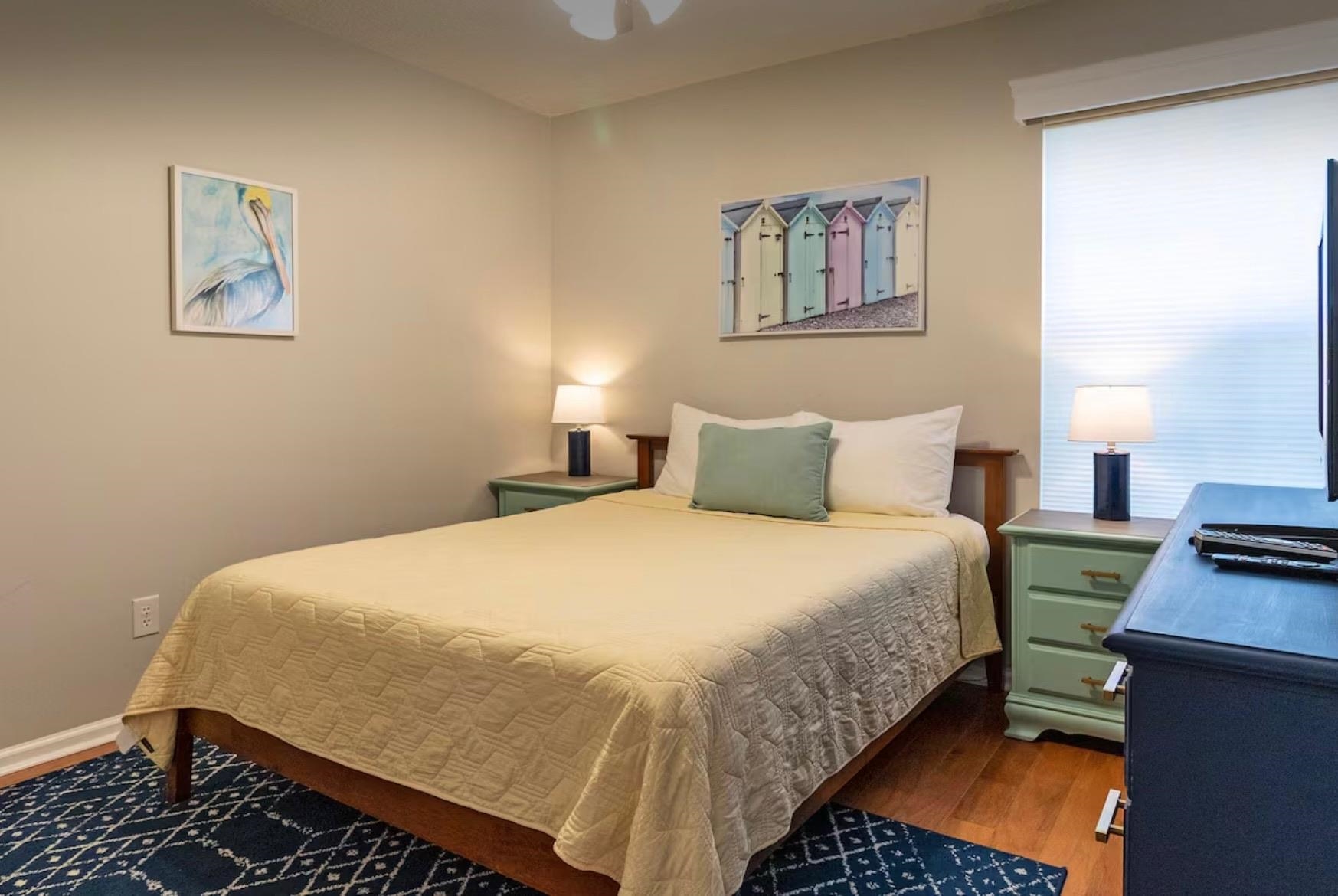 5340 4th Street St. Augustine, FL 32080 - Photo 20 of 29 a bedroom with a bed and a lamp on desk