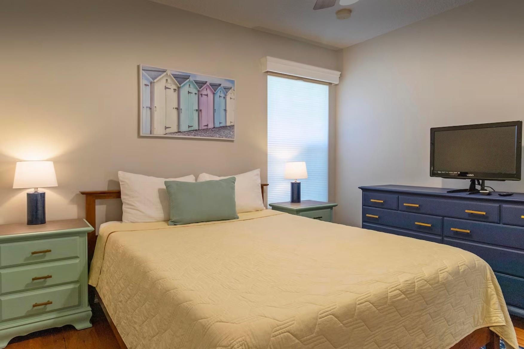 5340 4th Street St. Augustine, FL 32080 - Photo 21 of 29 a bedroom with a bed and a flat screen tv