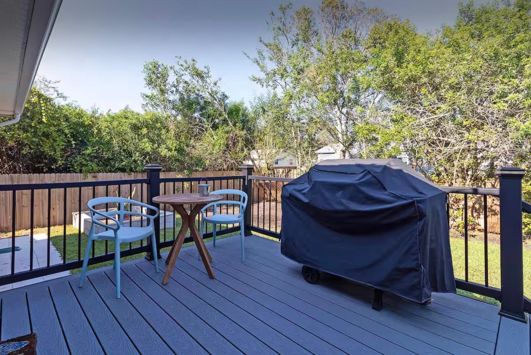 5340 4th Street St. Augustine, FL 32080 - Photo 23 of 29 a view of a deck with table and chairs with wooden floor and fence