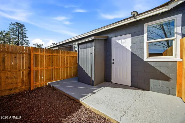 a view of backyard with garage