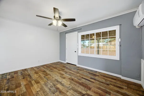 a view of an empty room with a window