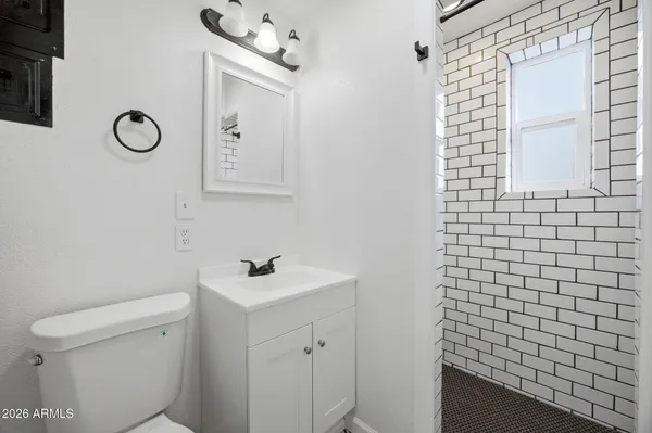 a bathroom with a sink toilet and vanity
