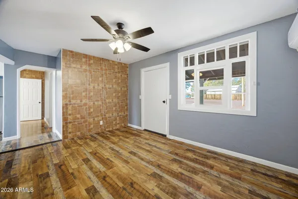 a view of an empty room with a window