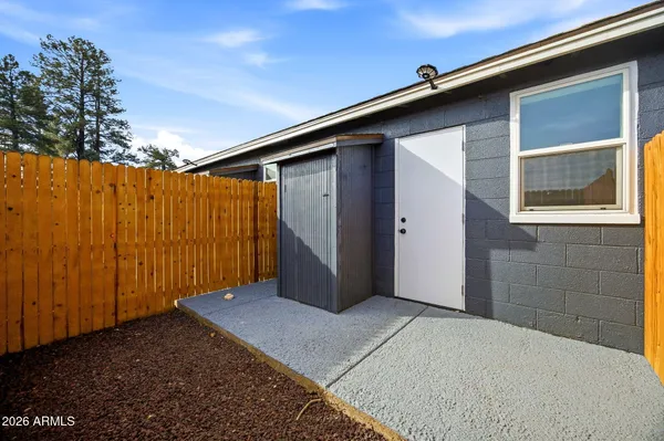 a view of backyard with garage