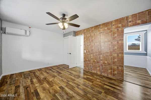 a view of an empty room with a window