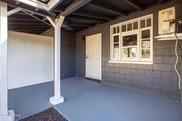 a view of an empty room with a window