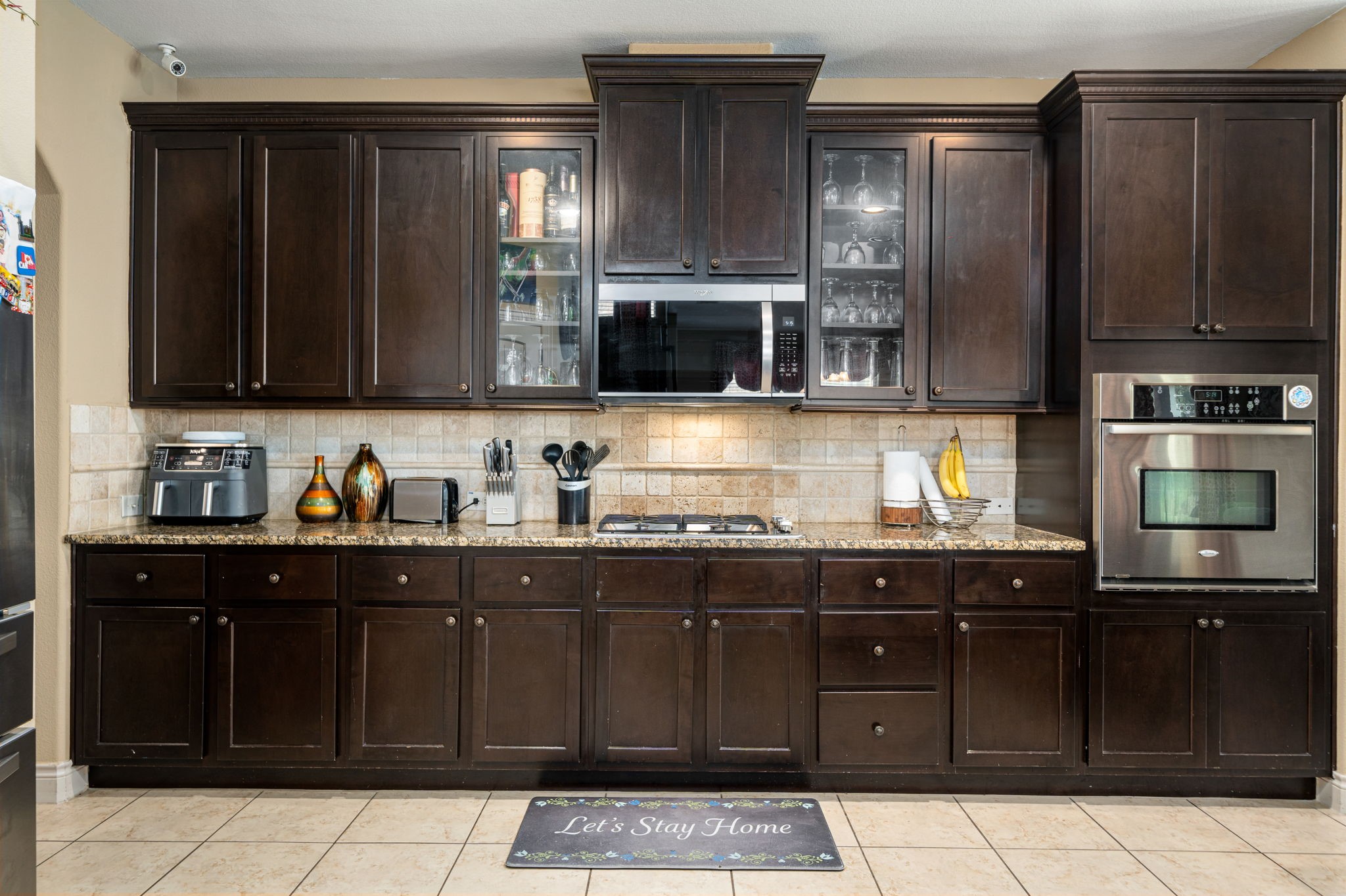5110 Ruby Rock Way Richmond, TX 77407 - Photo 12 of 27 a kitchen with granite countertop a sink and cabinets