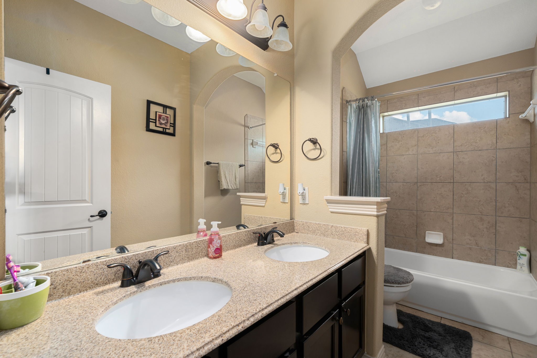 5110 Ruby Rock Way Richmond, TX 77407 - Photo 20 of 27 a bathroom with a granite countertop sink and a mirror