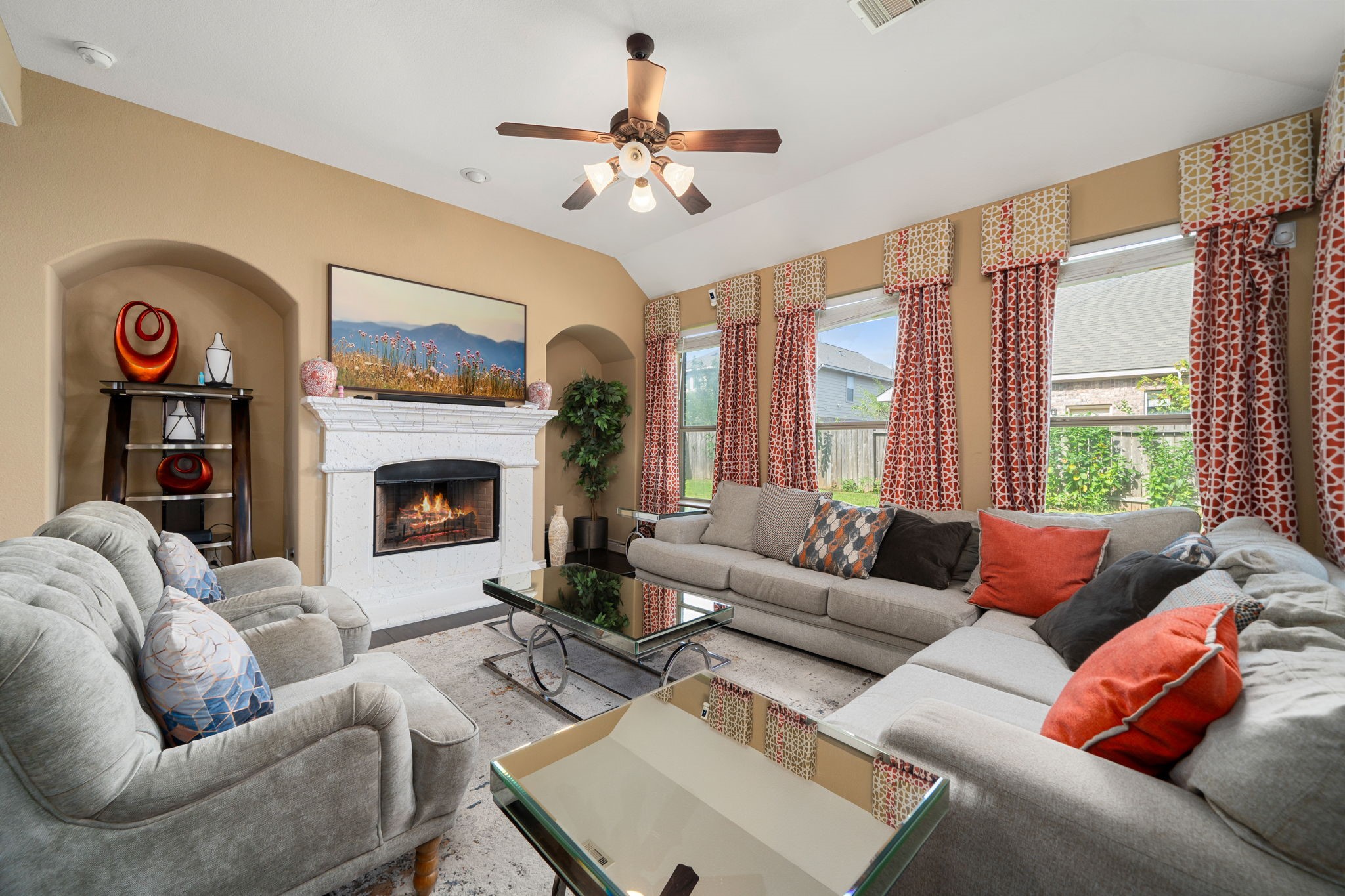 5110 Ruby Rock Way Richmond, TX 77407 - Photo 9 of 27 a living room with furniture a fireplace and a large window