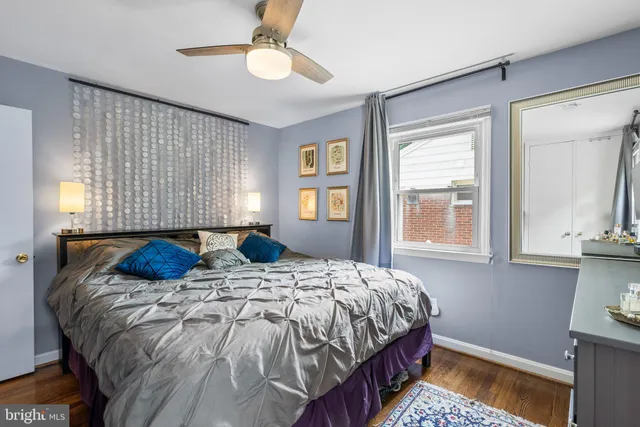 a bedroom with bed and a window