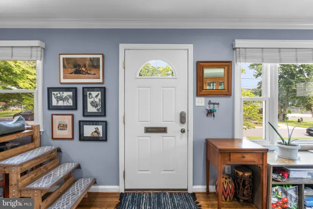 a view of a livingroom with furniture and a window
