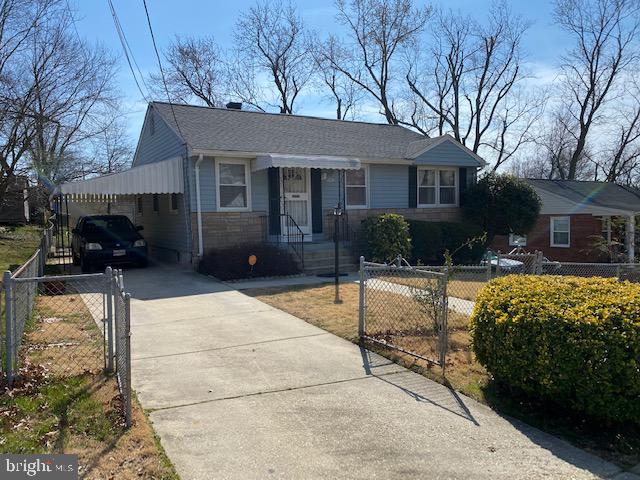 5905 Jamestown Road Hyattsville, MD 20782 - Photo 2 of 25 a front view of a house with a yard and potted plants
