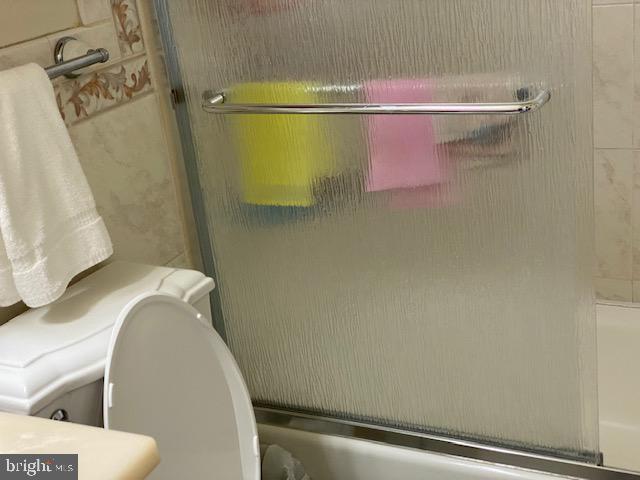 5905 Jamestown Road Hyattsville, MD 20782 - Photo 12 of 25 a bathroom with a shower and toilet