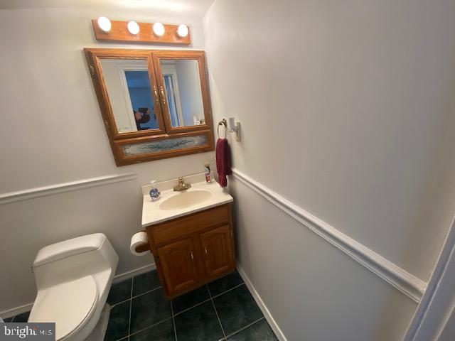 5905 Jamestown Road Hyattsville, MD 20782 - Photo 17 of 25 a bathroom with a sink and a mirror