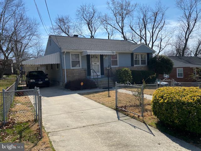 5905 Jamestown Road Hyattsville, MD 20782 - Photo 3 of 25 a front view of a house with a yard and potted plants