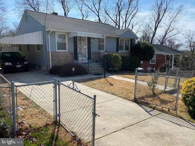 5905 Jamestown Road Hyattsville, MD 20782 - Photo 4 of 25 a view of a house with backyard and sitting area