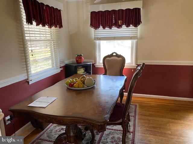 5905 Jamestown Road Hyattsville, MD 20782 - Photo 7 of 25 a view of a dining room with furniture and wooden floor