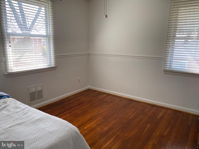 5905 Jamestown Road Hyattsville, MD 20782 - Photo 9 of 25 a bedroom with a bed and a window