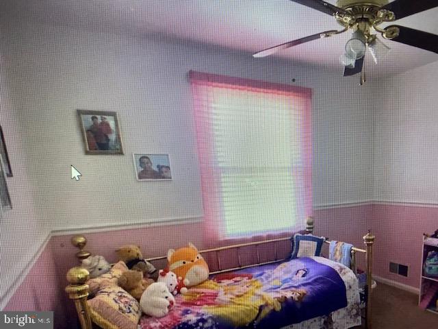 5905 Jamestown Road Hyattsville, MD 20782 - Photo 10 of 25 a bedroom with a bed and a window