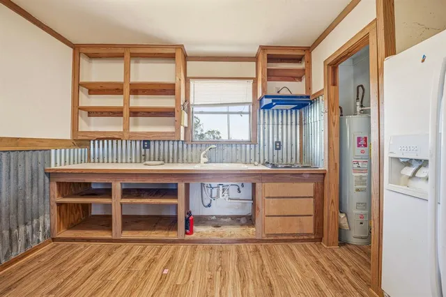 a view of front door with wooden floor