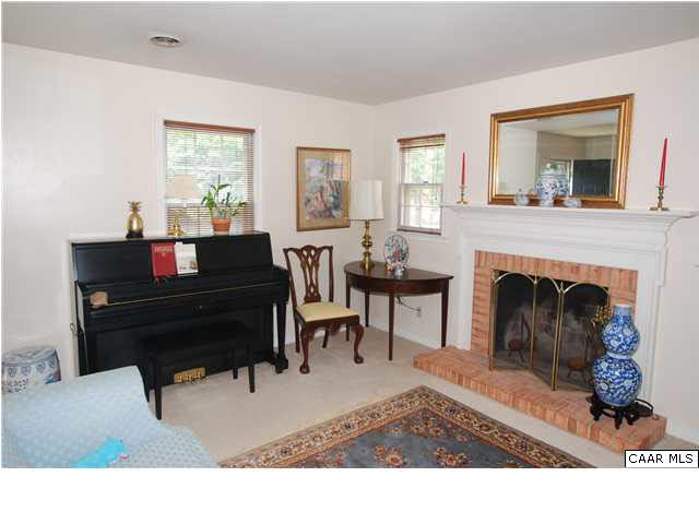 385 Minor Ridge Road Charlottesville, VA 22901 - Photo 5 of 15 a living room with furniture and a fireplace