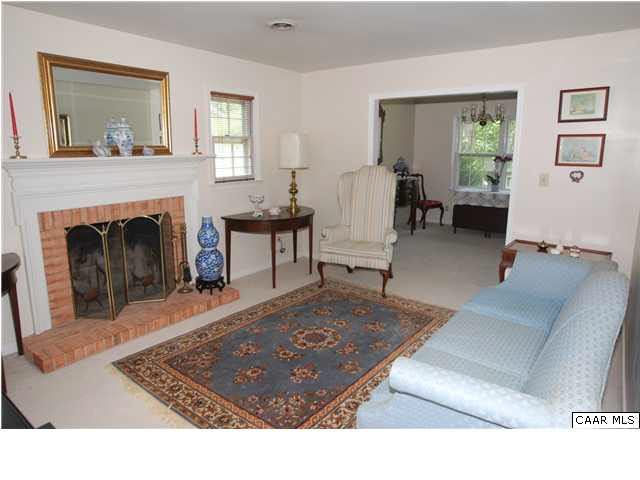 385 Minor Ridge Road Charlottesville, VA 22901 - Photo 7 of 15 a living room with furniture and a fireplace