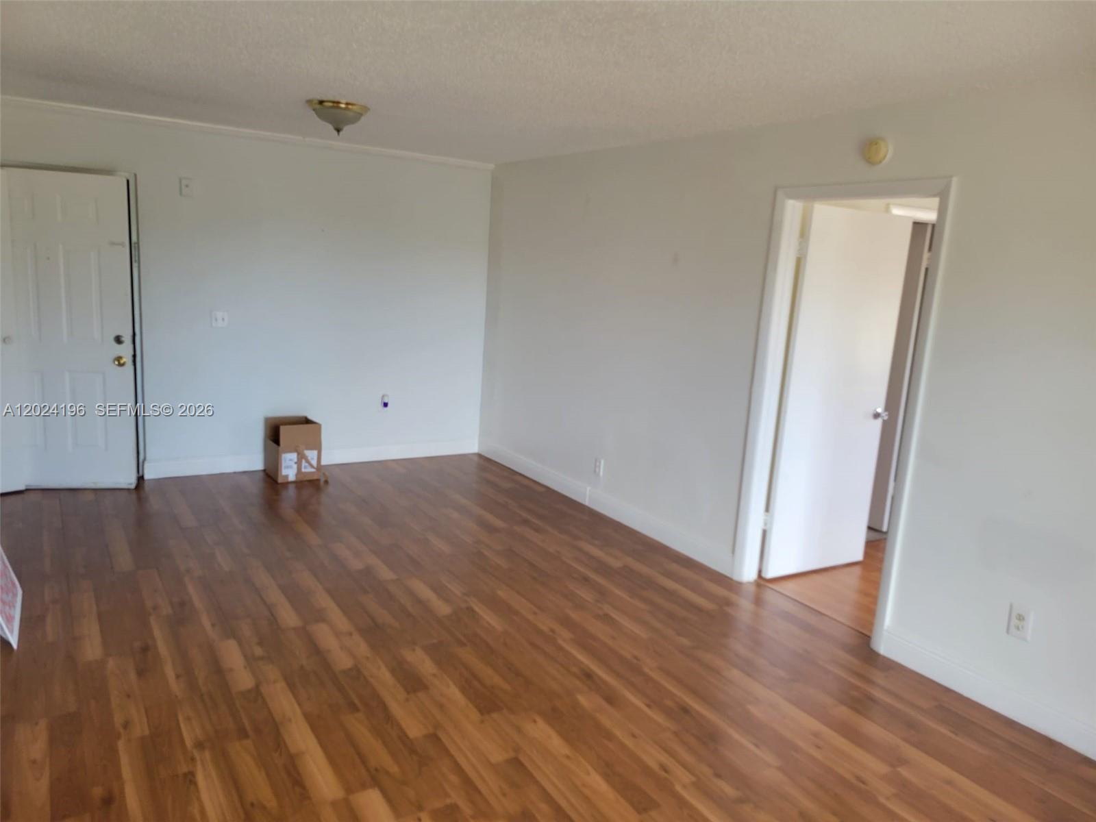 8260 Southwest 210th Street, Unit 319 Cutler Bay, FL 33189 - Photo 11 of 20 a view of empty room with wooden floor