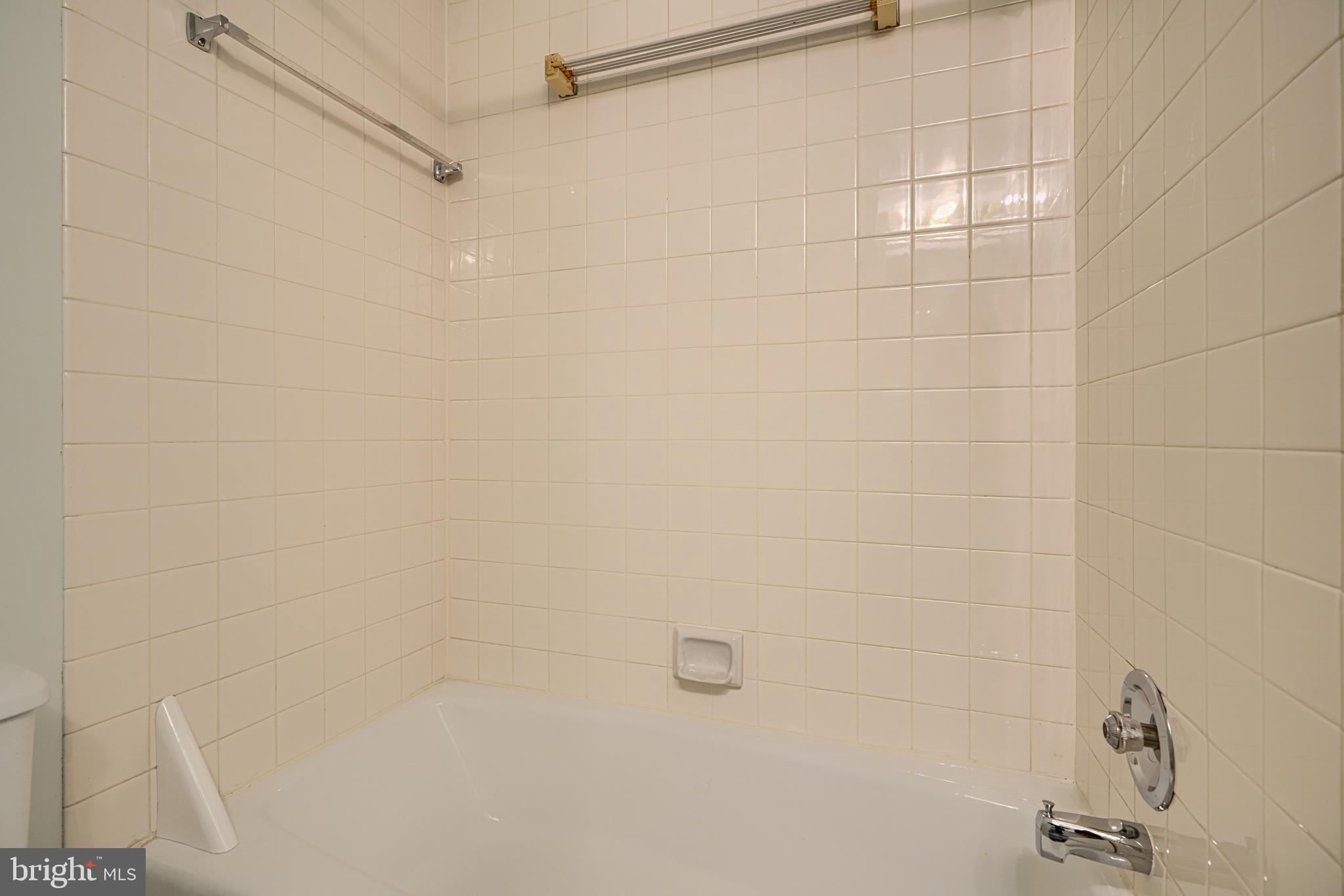 5712 Roland Avenue, Unit 1E Baltimore, MD 21210 - Photo 19 of 39 a bathroom with a shower