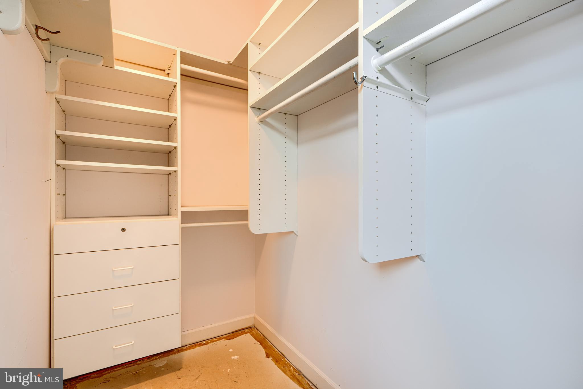 5712 Roland Avenue, Unit 1E Baltimore, MD 21210 - Photo 27 of 39 a view of walk in closet with empty racks