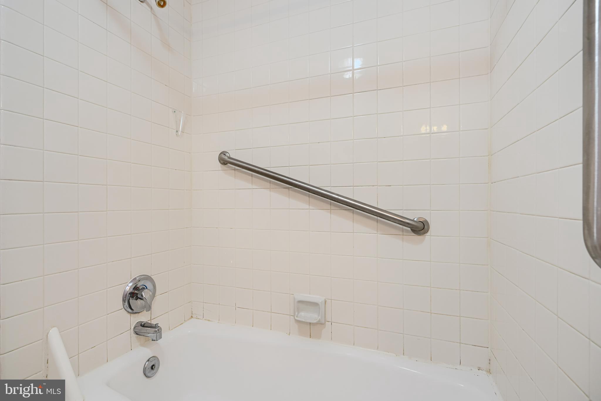 5712 Roland Avenue, Unit 1E Baltimore, MD 21210 - Photo 29 of 39 a bathroom with a sink and a shower