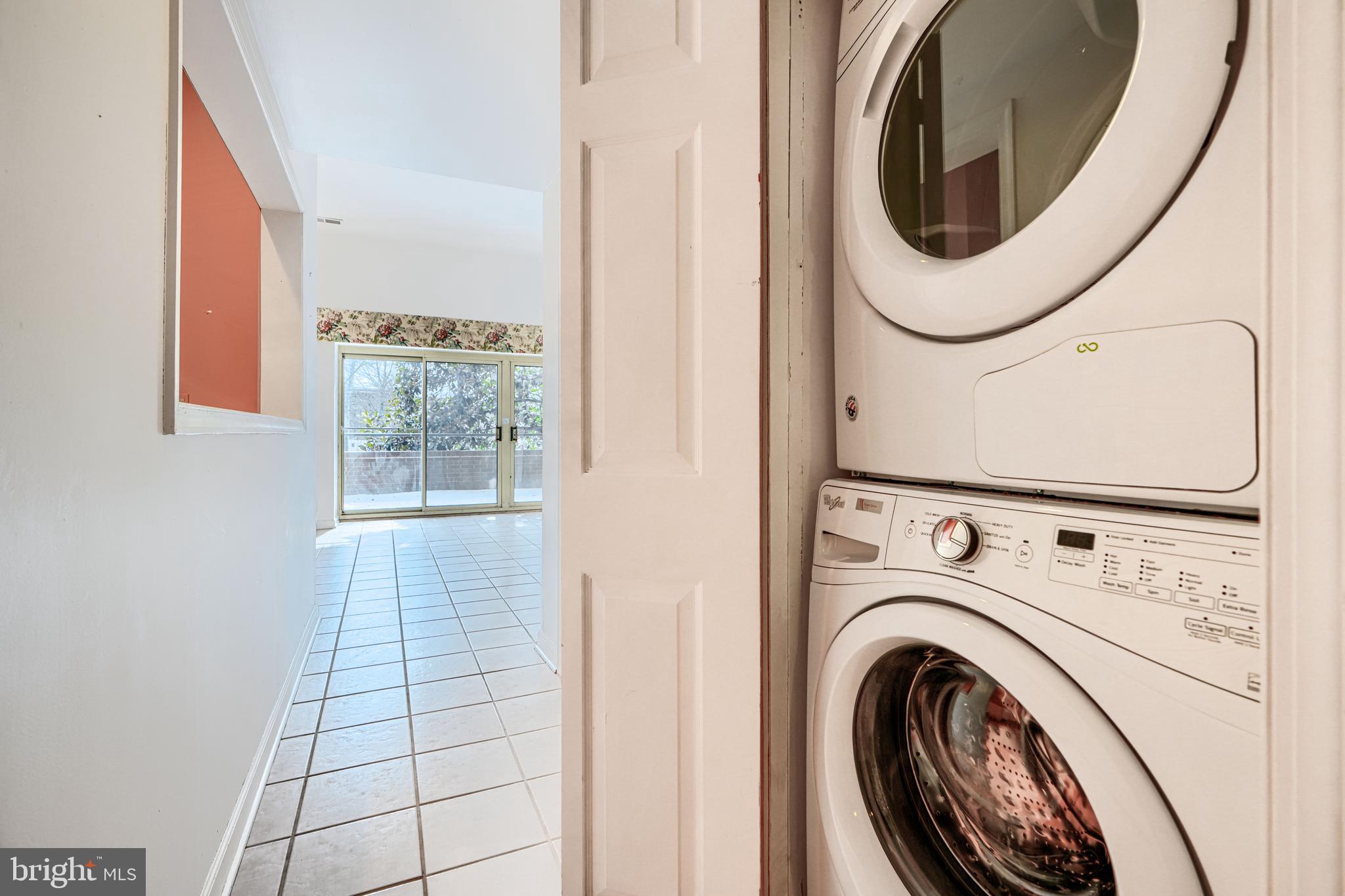 5712 Roland Avenue, Unit 1E Baltimore, MD 21210 - Photo 31 of 39 a close view of a utility room with dryer and washer