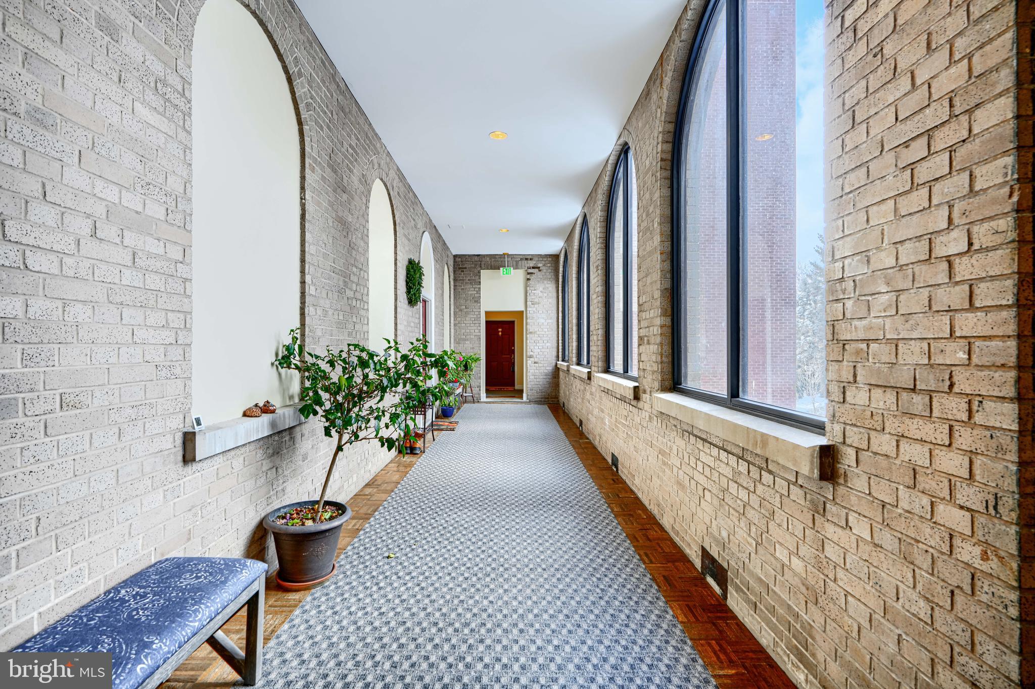 5712 Roland Avenue, Unit 1E Baltimore, MD 21210 - Photo 37 of 39 a lobby with furniture and potted plant