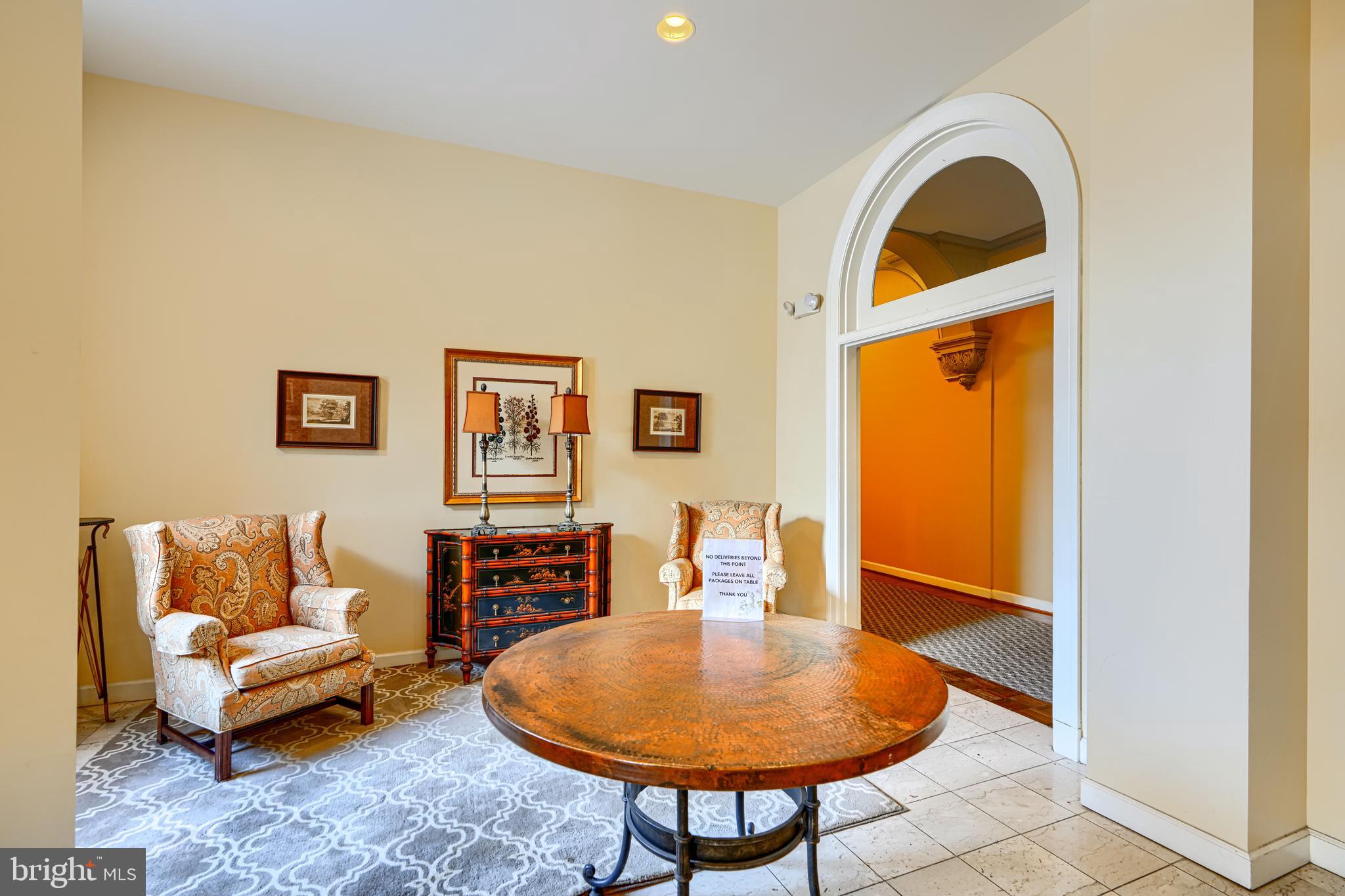 5712 Roland Avenue, Unit 1E Baltimore, MD 21210 - Photo 38 of 39 a living room with furniture and a window