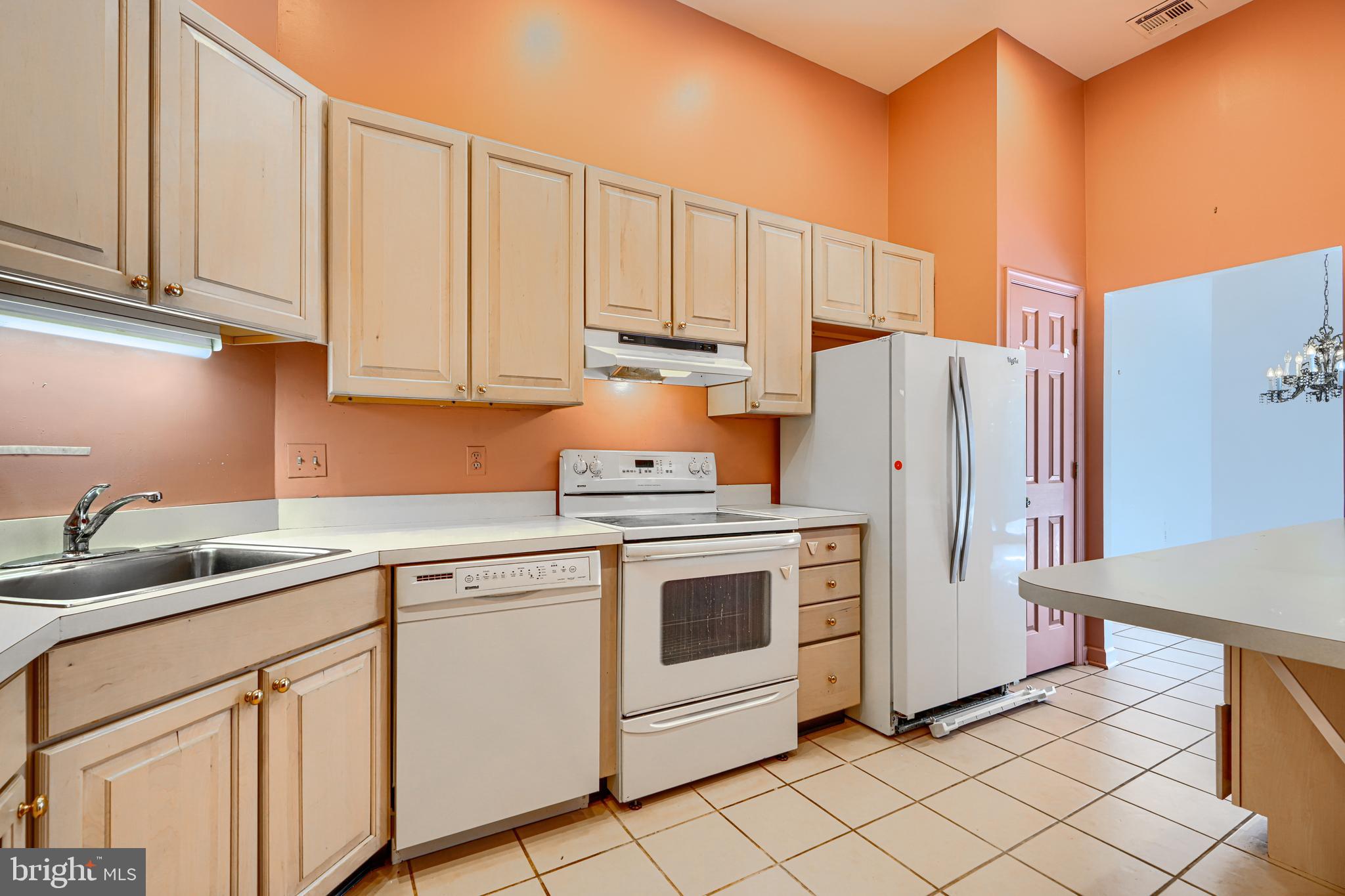 5712 Roland Avenue, Unit 1E Baltimore, MD 21210 - Photo 4 of 39 a kitchen with appliances cabinets and a sink