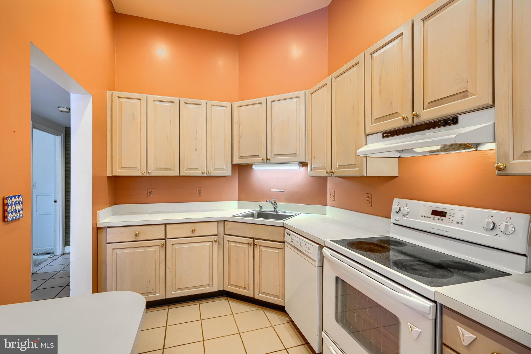 5712 Roland Avenue, Unit 1E Baltimore, MD 21210 - Photo 6 of 39 a kitchen with a sink cabinets and appliances