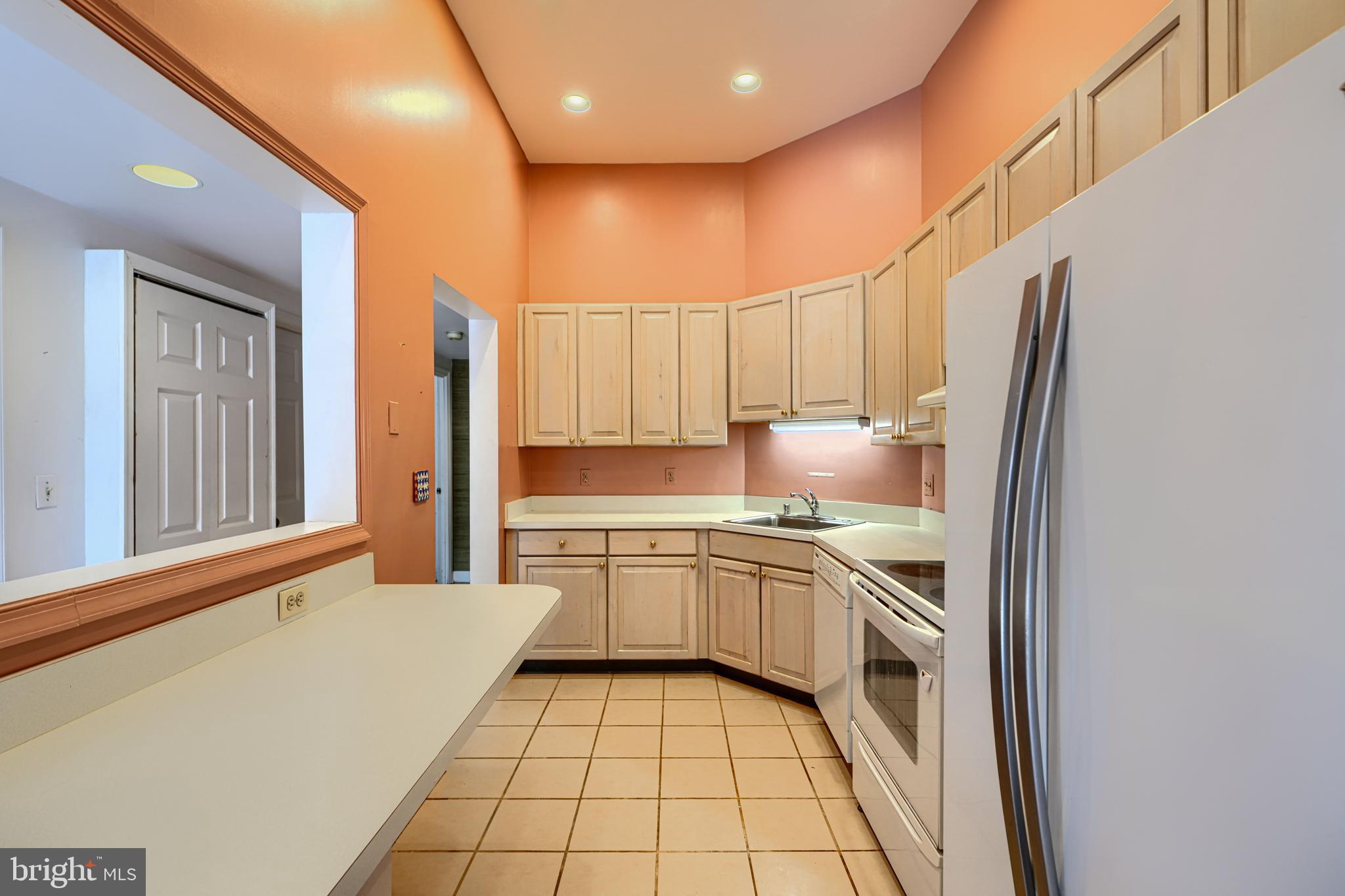 5712 Roland Avenue, Unit 1E Baltimore, MD 21210 - Photo 7 of 39 a kitchen with a sink cabinets and appliances
