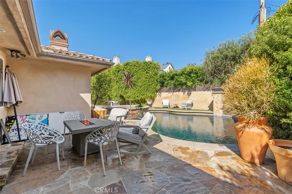 a view of a swimming pool with a patio