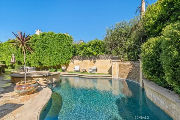 a view of a swimming pool with a patio
