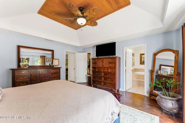 a spacious bathroom with a double vanity sink mirror and shower
