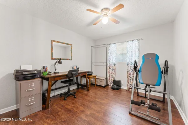 a living room with furniture and a rug