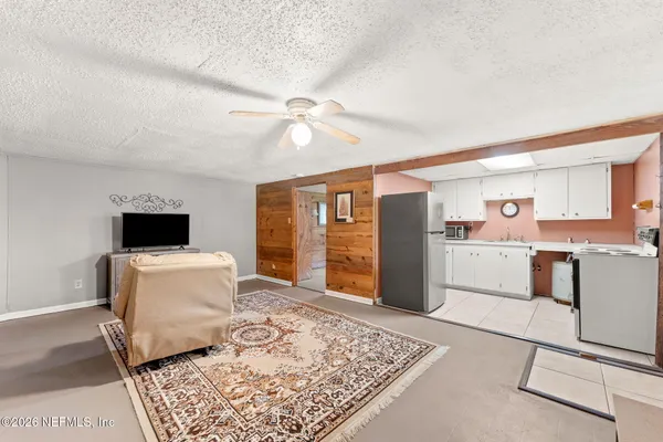 a kitchen with a stove a refrigerator and a sink