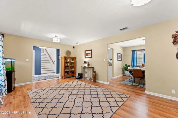 a bedroom with furniture and a flat screen tv