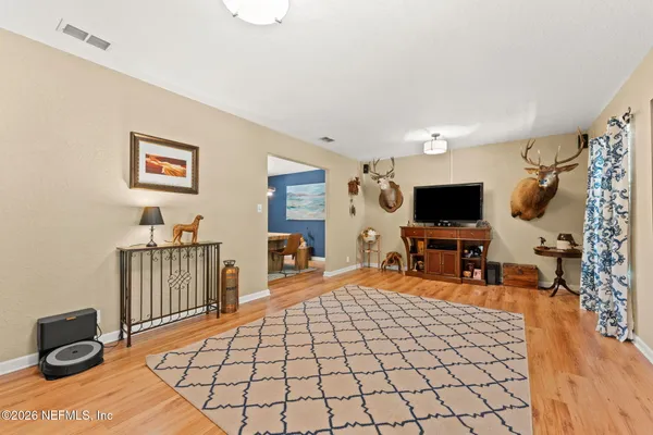 a dining room with furniture and window
