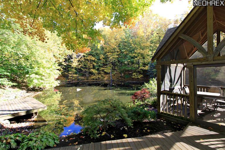 7900 Bainbridge Road Bainbridge, OH 44023 - Photo 23 of 25 This professionally landscaped secret garden has been featured on many renowned garden tours. It features a one-of-a-kind custom screened gazebo, custom water features, meandering walking paths, 1500 sq ft of cascading decks that overlook the half acre pond with two islands, custom lighting, and an irrigation system with a separate irrigation well.