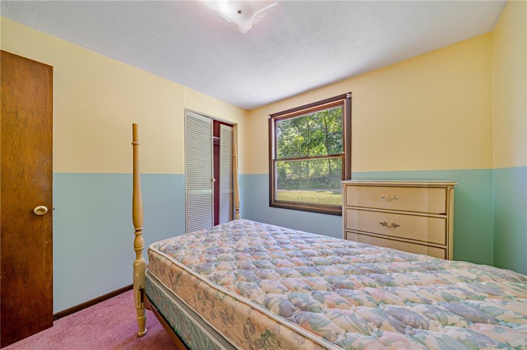 1124 Hemlock Road Indiana, PA 15701 - Photo 13 of 29 a bedroom with a bed and a window