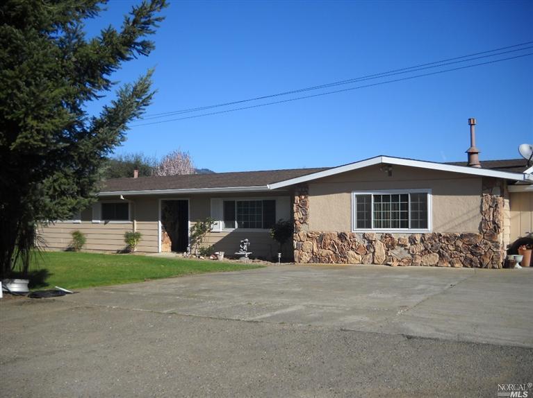 1900 Held Road Redwood Valley, CA 95470 - Photo 1 of 1 a front view of a house with a yard